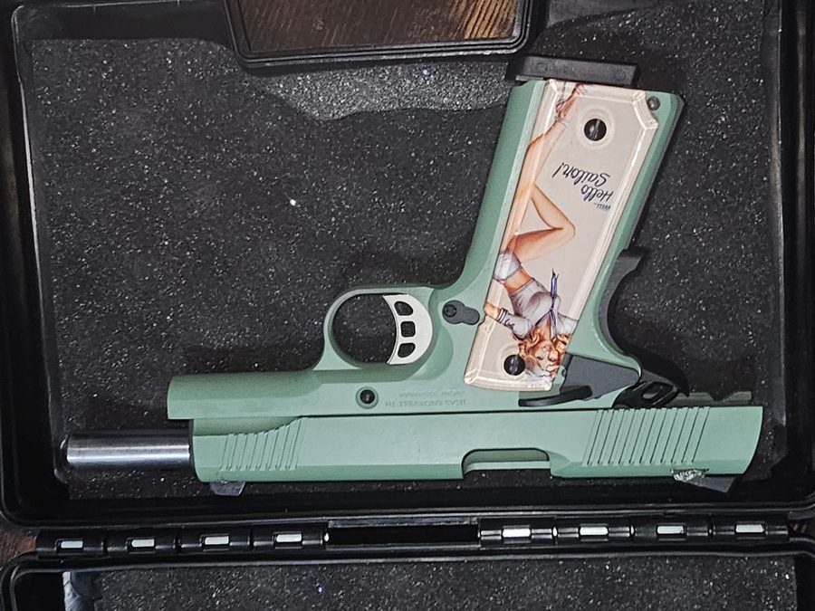 Mint green 1911 with custom pin-up grip panels