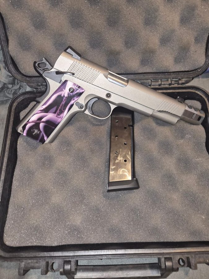 Stainless 1911 with purple marbled grip panels